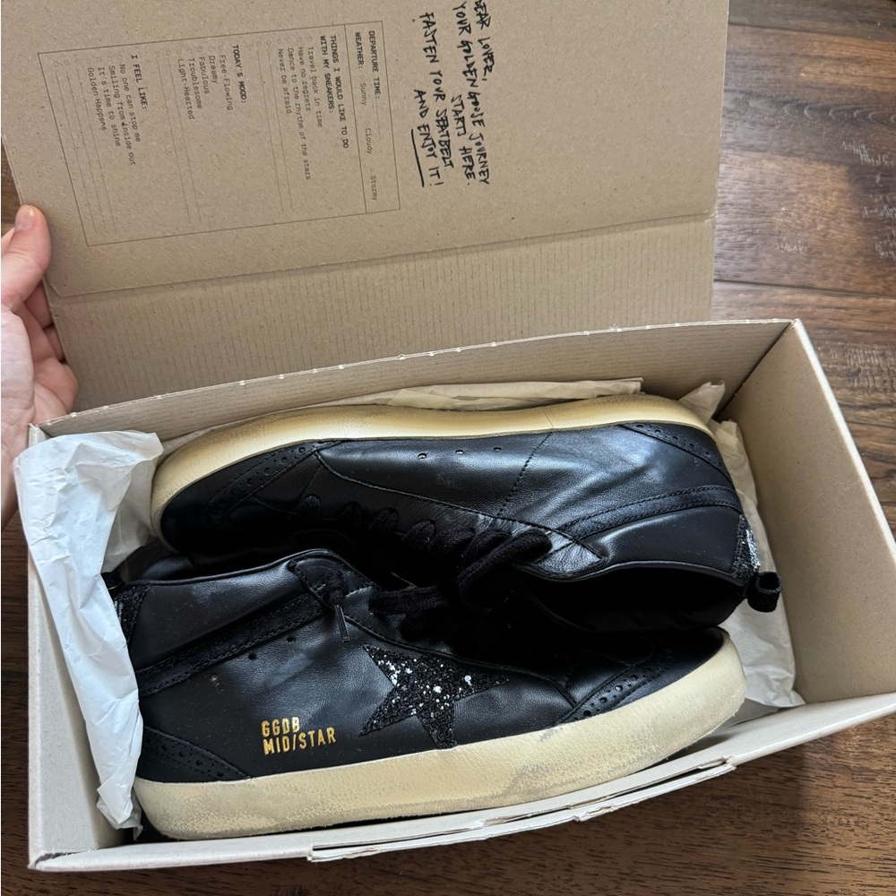Golden Goose Black and Gold Mid Star Sneakers